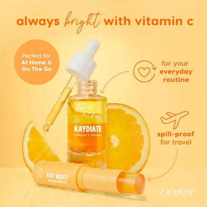 Raydiate vitamin C serum with dropper and ego boost stick on a yellow background