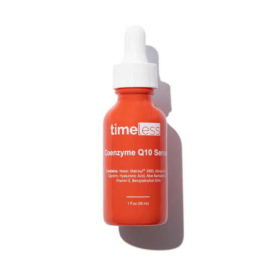Red serum bottle with dropper labeled 'timeless' on a white background