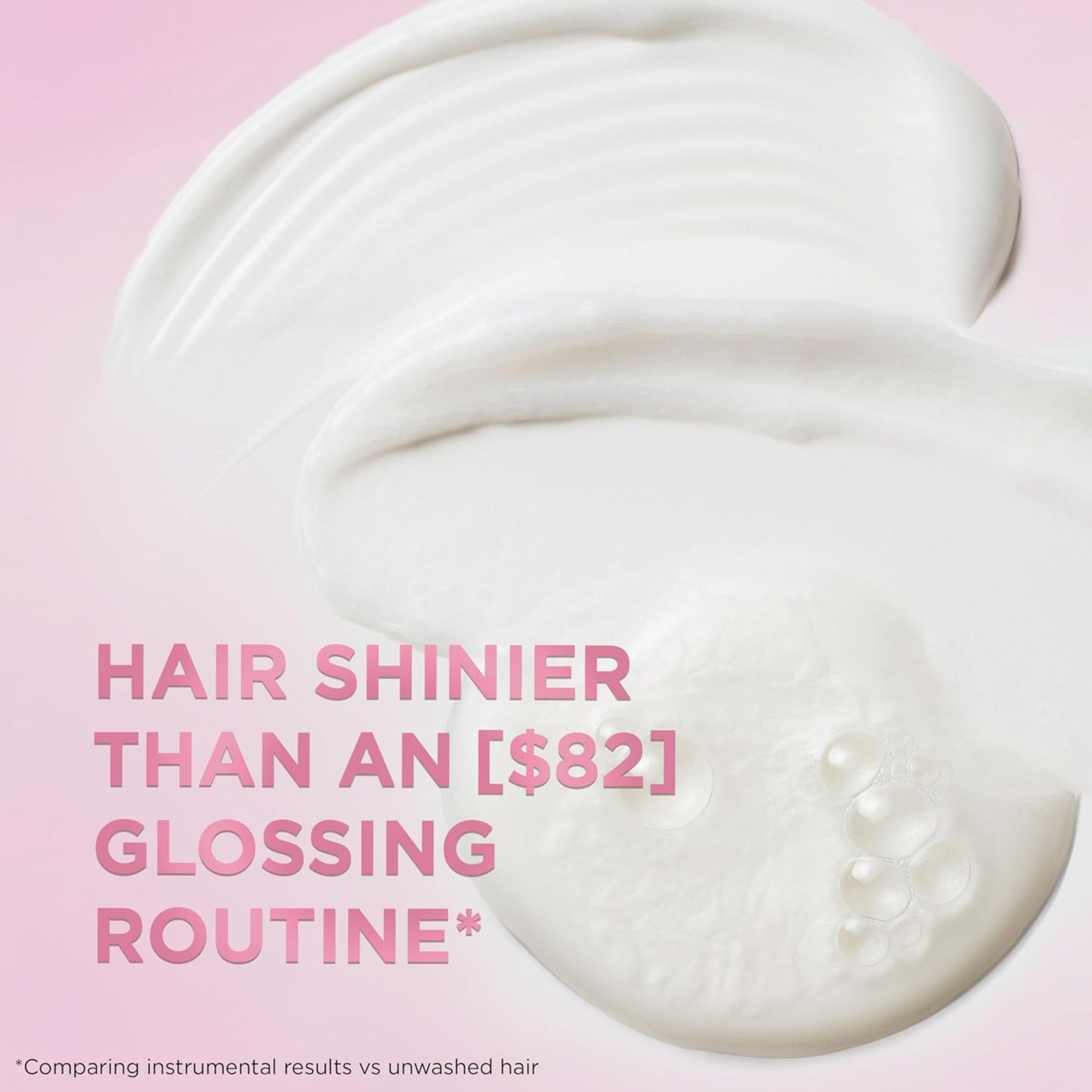 Close-up of a white hair product with text on a pink background