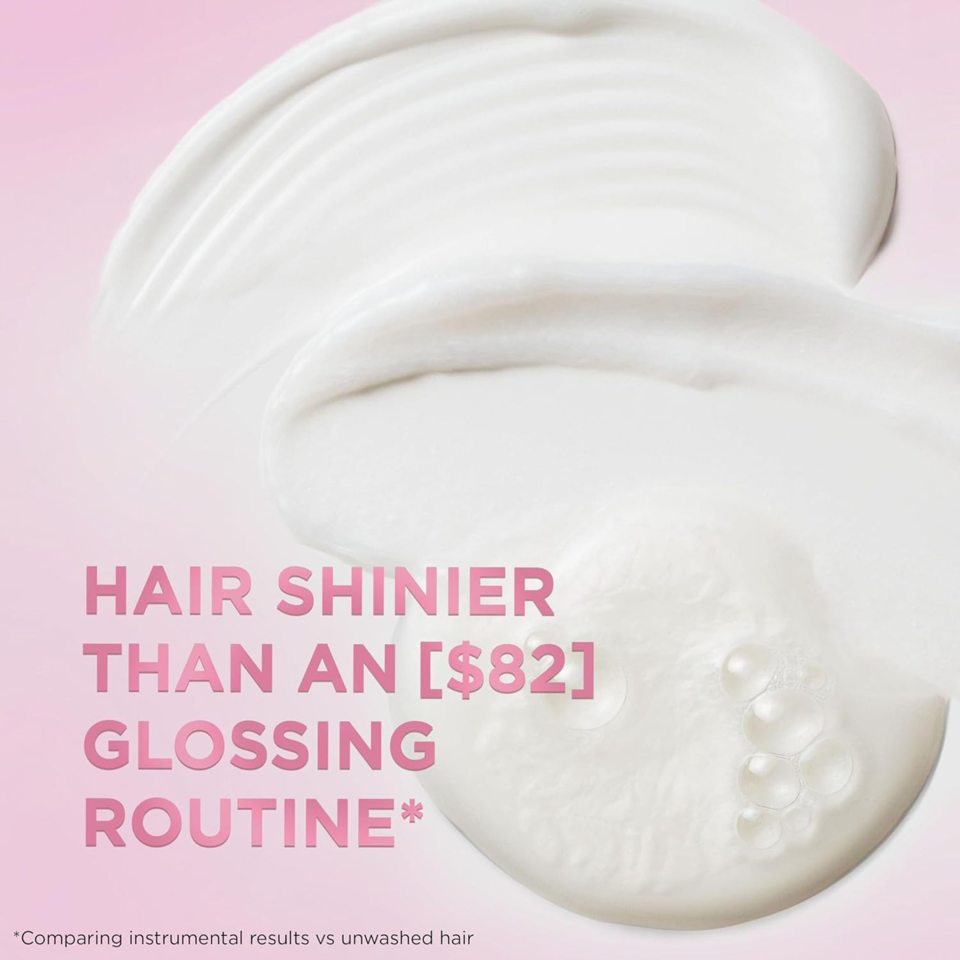 Close-up of a white hair product with text on a pink background