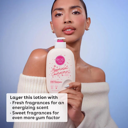 Woman holding an eos peppermint cashmere lotion bottle against a light blue background