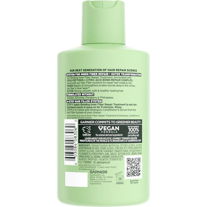 Green hair care product bottle with label on a white background