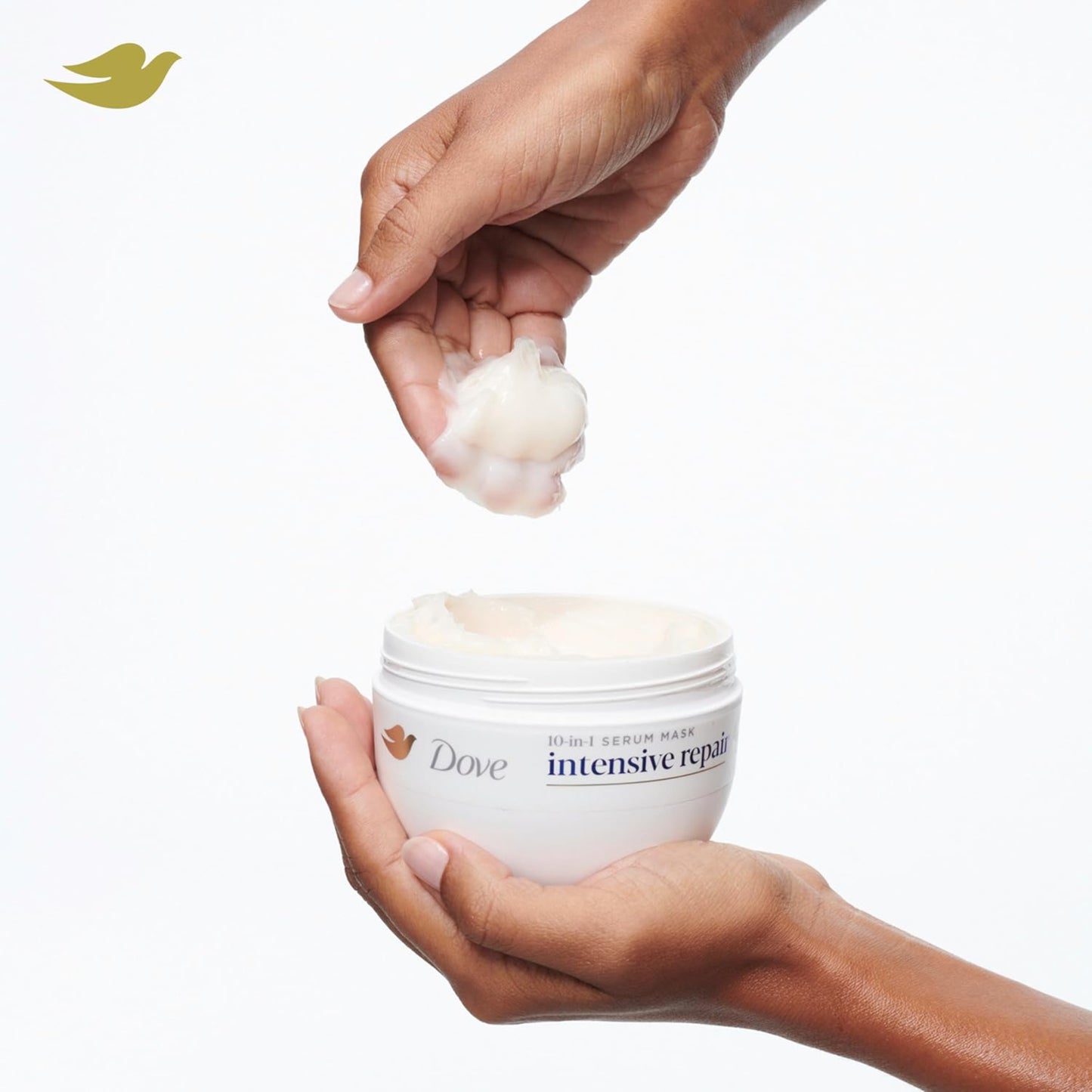 Dove intensive repair product with a hand holding cream and another hand holding the jar on a white background
