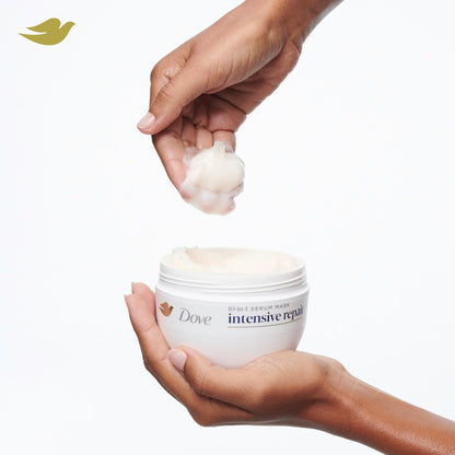 Dove intensive repair product with a hand holding cream and another hand holding the jar on a white background