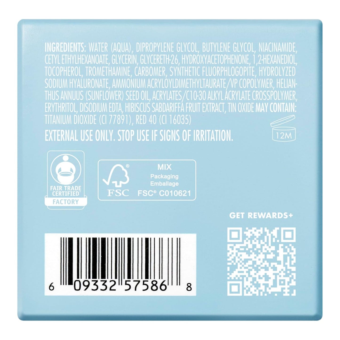 Back of a soap packaging with text, barcodes, and logos on a light blue background