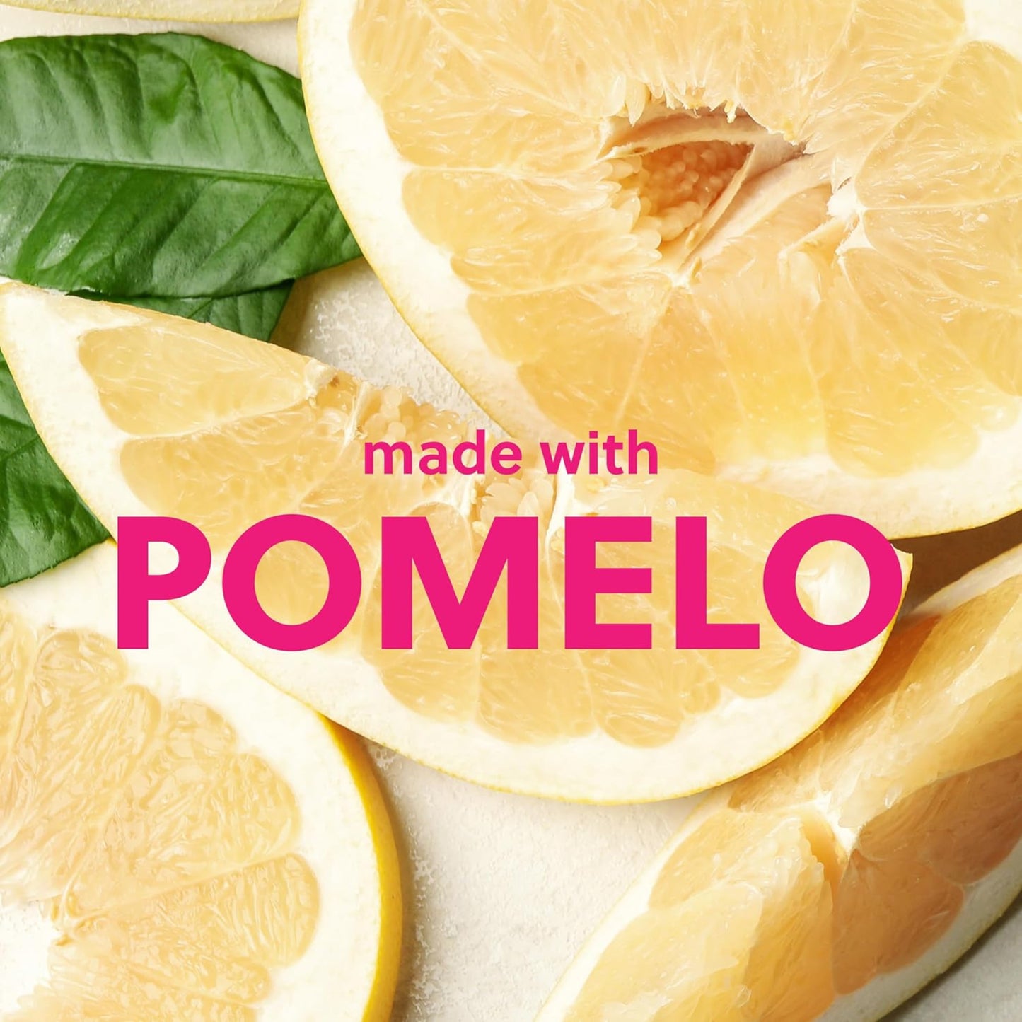 Sliced pomelo fruit with green leaves on a light background, featuring the text 'made with POMELO'.