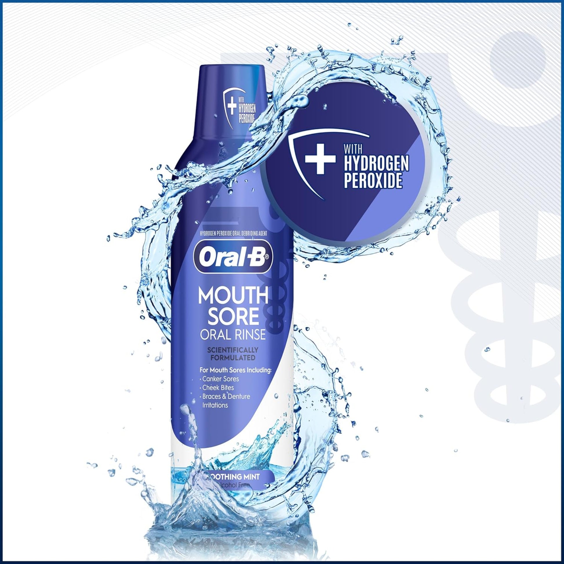 Oral-B Mouth Sore Oral Rinse bottle with water splashes on a white background