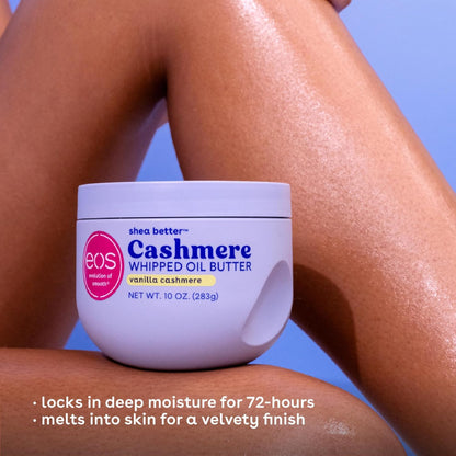 Jar of eos Cashmere Whipped Oil Butter on a person's arm with a blue background