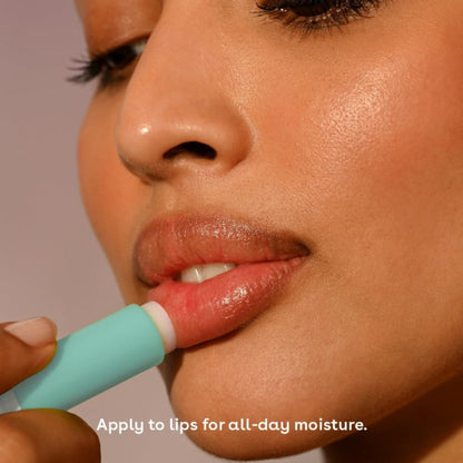 Person applying lip balm with a focus on lips and text about lip care.