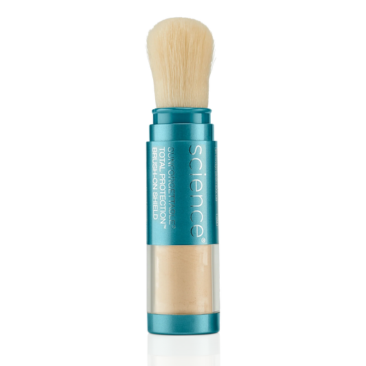 Makeup brush with blue handle and clear container on a white background